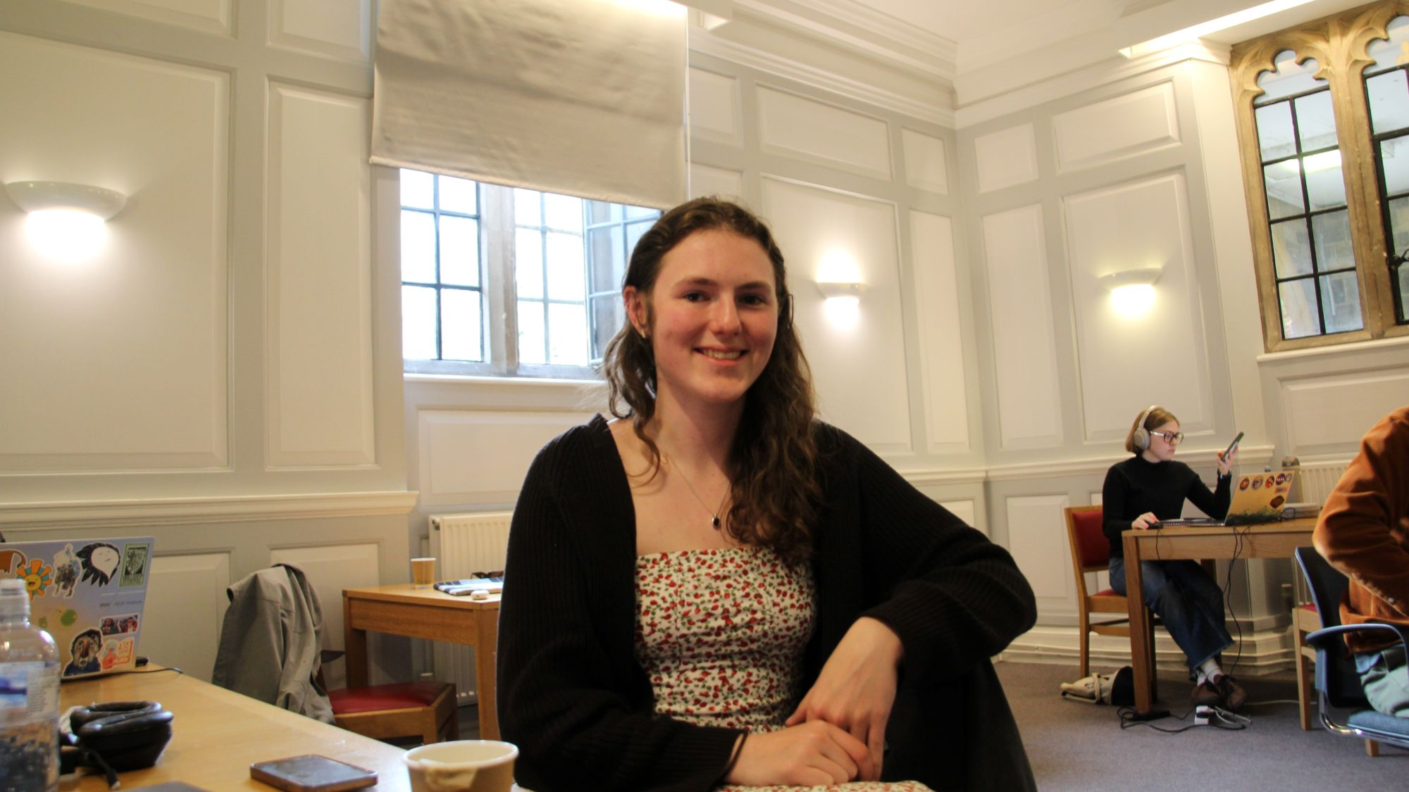 A student smiling and looking into the camera