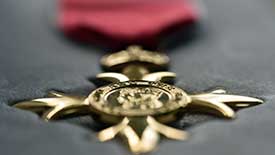 Close-up of a gold medal with intricate design