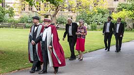 Guests walking up path to Hall for Deans' Dinner