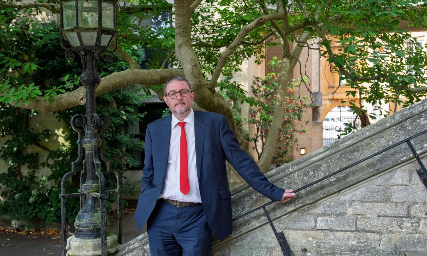 Professor Seamus Perry standing by the Hall steps