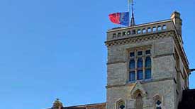 Balliol flag at half mast atop tower